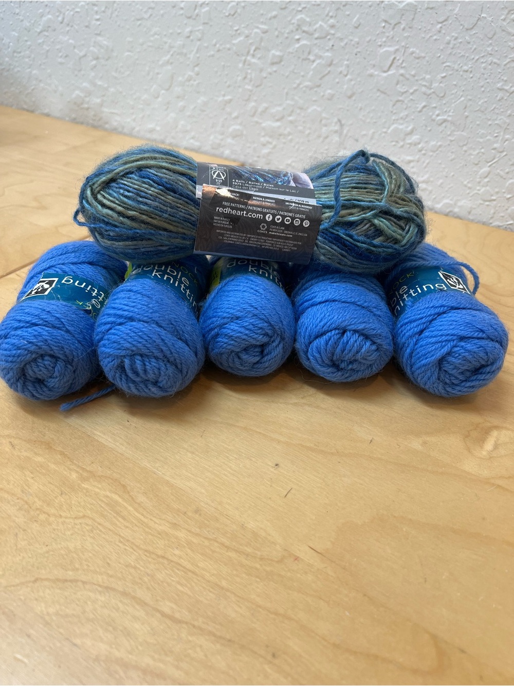 5 skeins 100% wool manufactured in Scotland in blue 1 skein in multi colour
